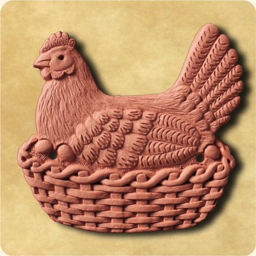 The Happy Hen sitting on a basket The Happy Hen sitting on a basket